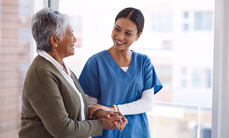Senior Woman and Nurse Smiling