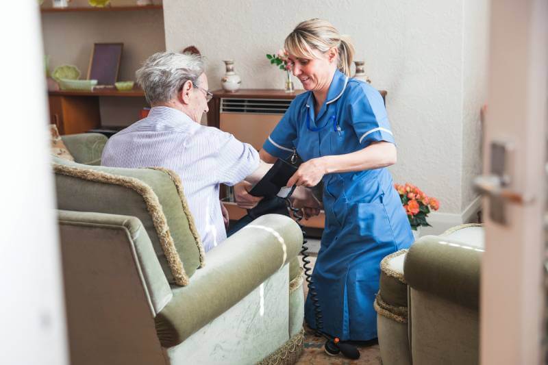 Nurse Assisting Senior Citizen