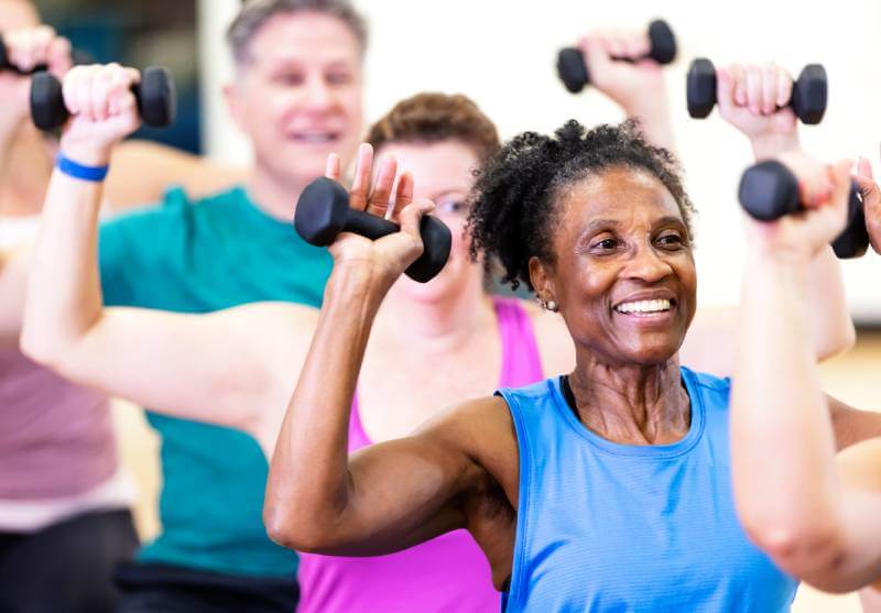 Seniors lifting weights