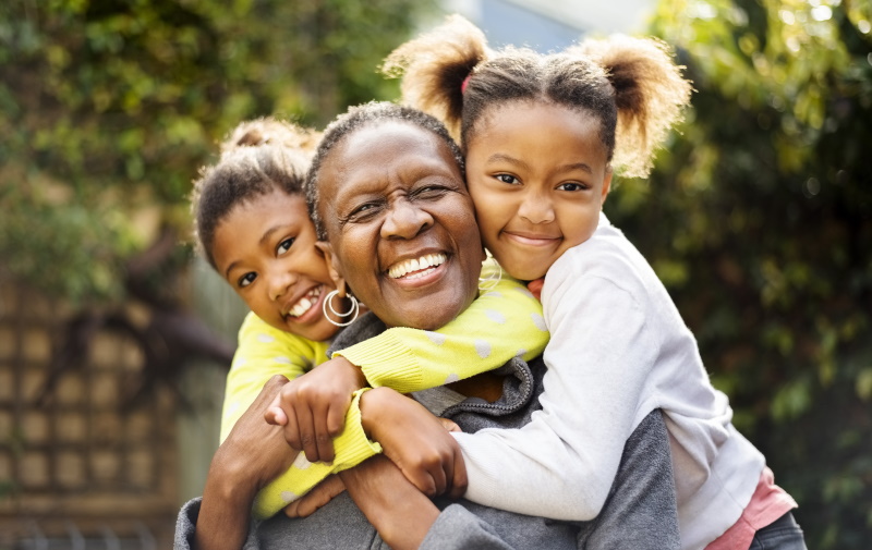 Grandkids hugging their Grandmother