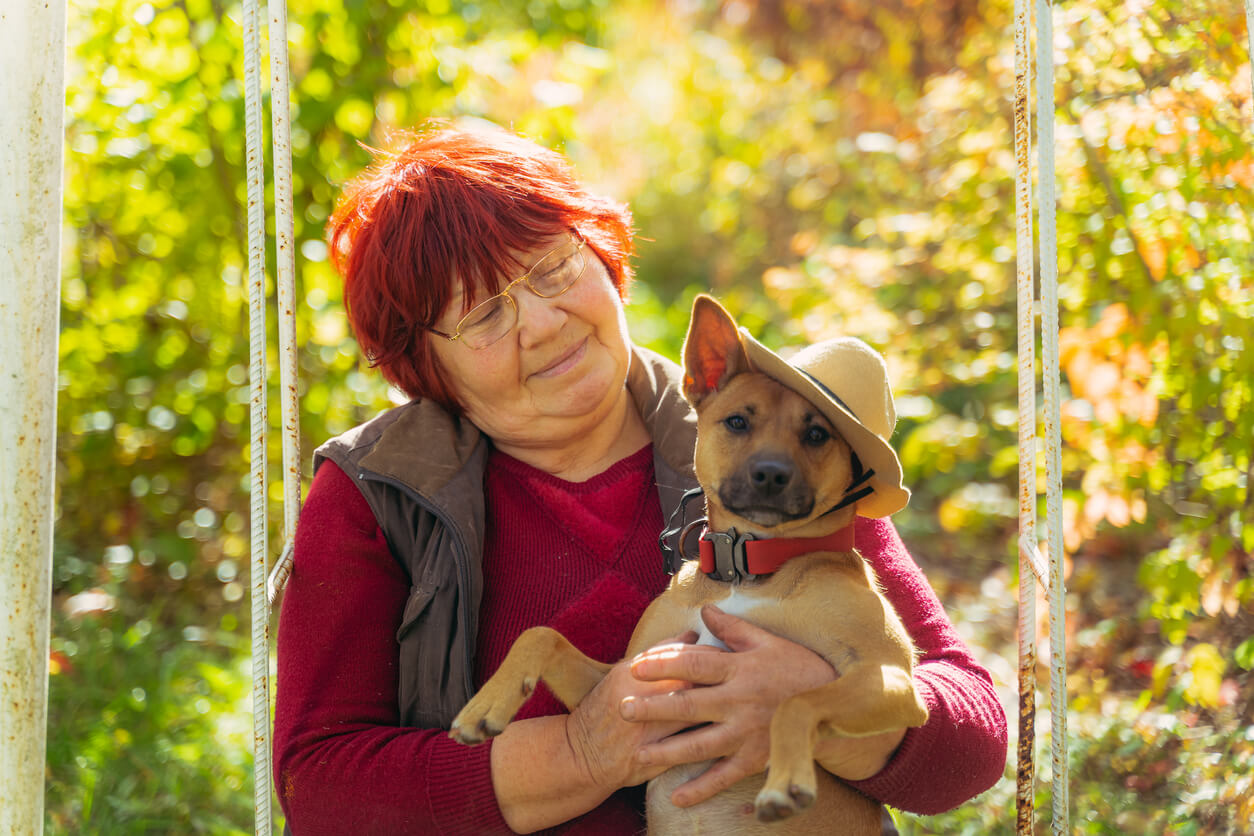 Woman Holding Dog