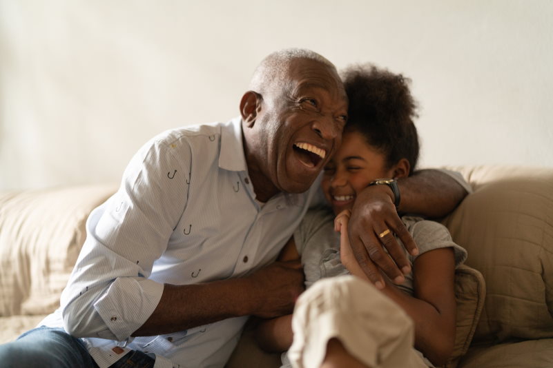 Grandfather and Granddaughter laughing