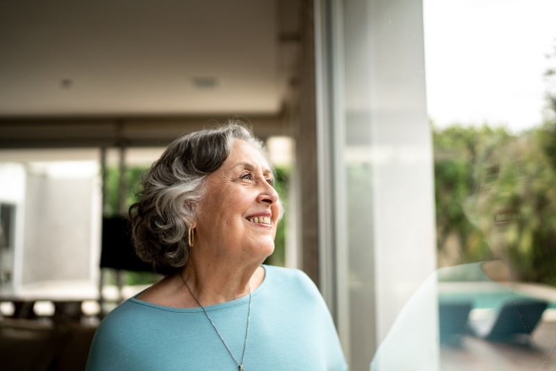 Woman Smiling out the Window