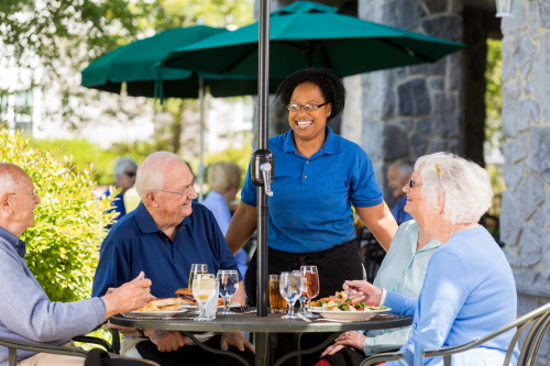 Couples Sharing a Meal on a Patio