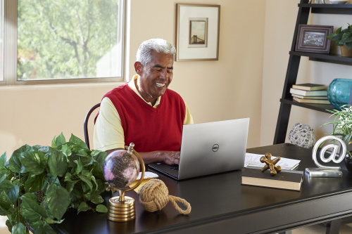 Man Typing on Laptop